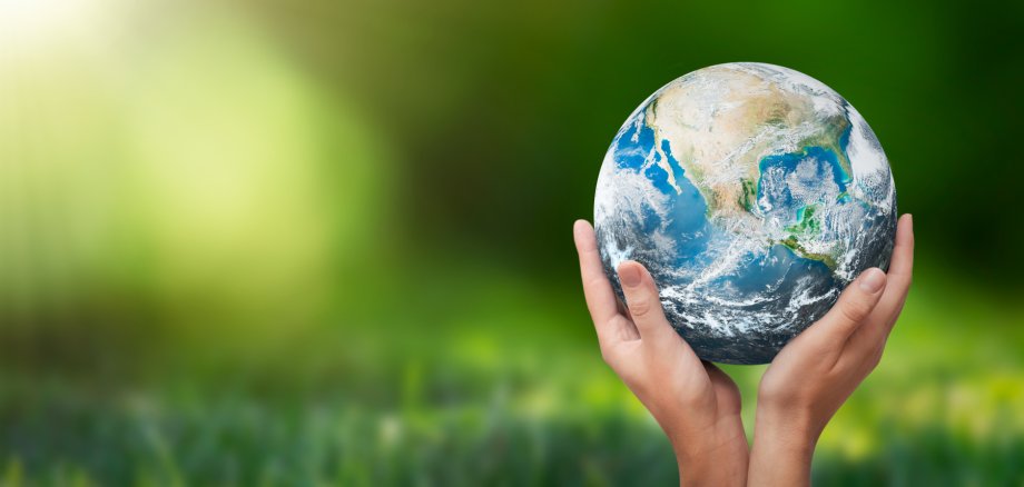 Hands raised to Earth. Environment protection Hands raised to Earth. Environment protection
