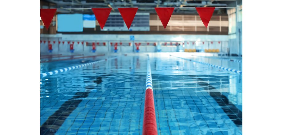 Modern swimming pool with blue water, indoors Modern swimming pool with blue water, indoors
