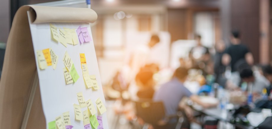 Business people meeting at office and use post it notes to share